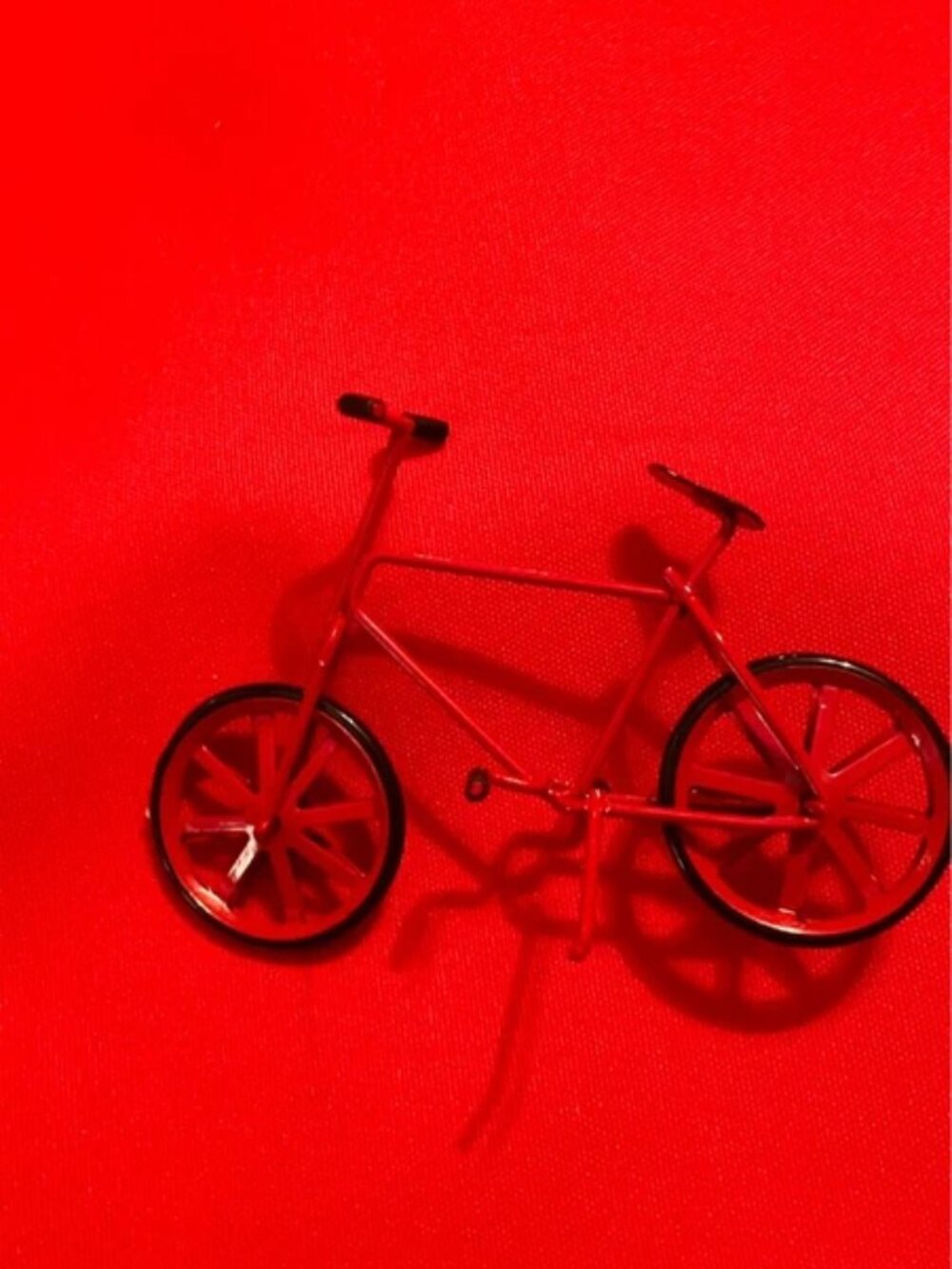 Miniature red bicycle